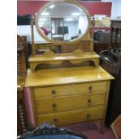 Early XX Century Light Oak Dressing Table, having oval mirror and three graduated drawers, 91cm