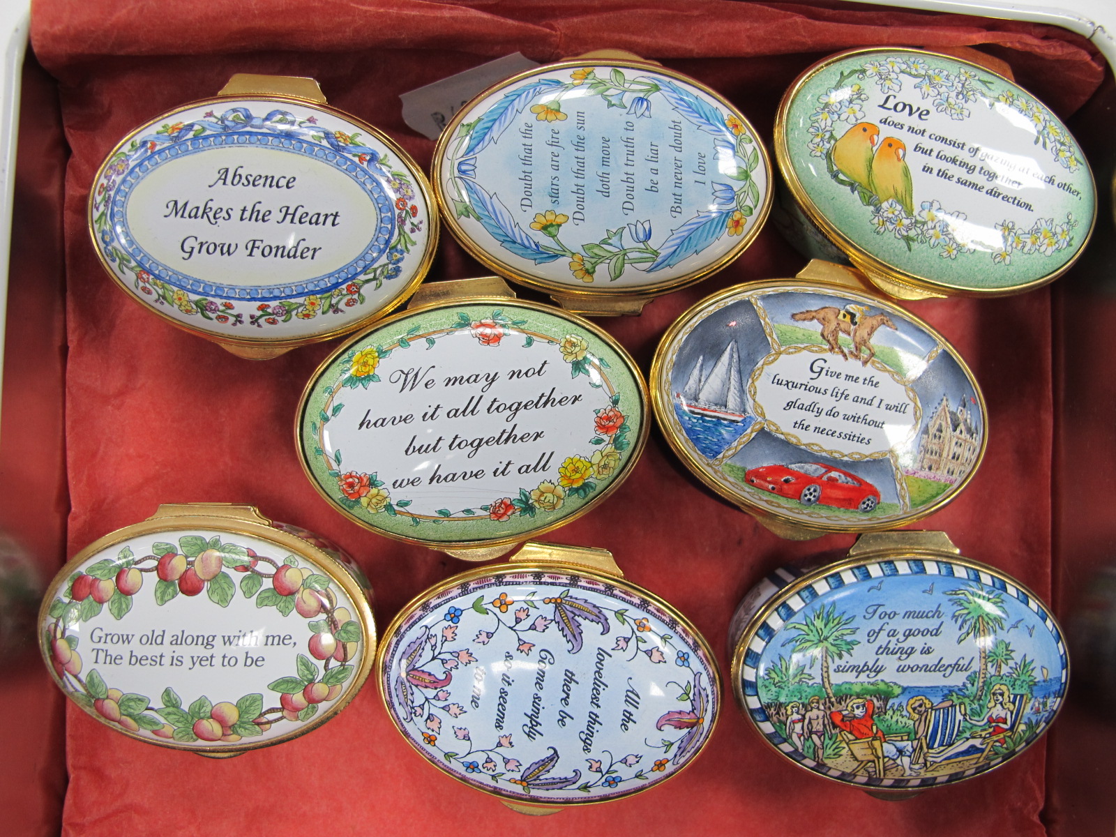 Eight Staffordshire Enamels Oval Trinket Boxes, each painted and with romantic verse, all 5.3cm