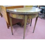 A Late XVIII Century Mahogany Demi-Lune Tea Table, with baized interior, on tapering legs and