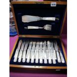 An Early XX Century ''GG + SS'' Twelve Piece Fish Service with mother of pearl handles, in oak case.