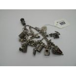 A Curb Link Charm Bracelet, to heart shape padlock clasp, suspending assorted charm pendants;