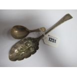 A Hallmarked Silver Berry Spoon, later decorated; a hallmarked silver caddy spoon. (2)