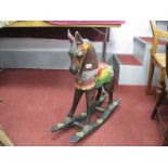 A Carved and Painted Small Child's Wooden Rocking Horse, 70cm high.
