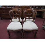 A Set of Four XIX Century Mahogany Balloon Back Dining Chairs, each with carved lower bar and turned