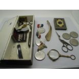 A Decorative Box Containing a Pair of Lorgnettes, scissors, three commemorative "Churchill" coins,