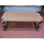 An Early XX Century Oak Rectangular Shaped Stool, with upholstered top, on cup cover supports, paw