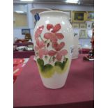 Moorcroft Pottery Vase, of ovoid form decorated with pink flower on cream ground, 18.5cm high,