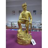 A Brass Figure of a Coal Miner, leaning on a pick axe, holding a lamp, 31cm high.