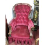 XIX Century Mahogany Armchair, with a hooped back, upholstered back and seat, shaped arms, on reeded