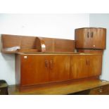 G Plan Teak Lounge Four Drawer Sideboard, curved end section with upper shelved compartment.