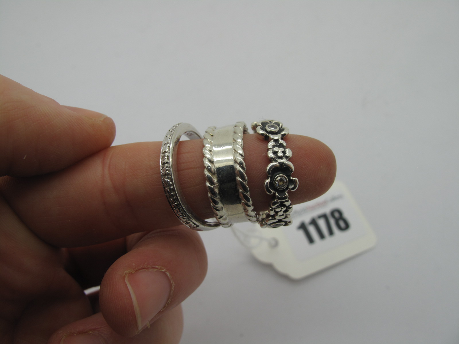 Pandora Flowerhead Band, stamped "S925 ALE 58"; a Scottish hallmarked silver band; a half eternity