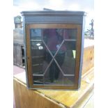 Early XX Century Mahogany Glazed Corner Cupboard, with blind fret decoration, glazed astragal