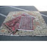 A Middle Eastern Wood Tassled Rug, with all over geometric motifs, square and octagonal centre