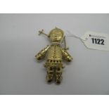 A Large Novelty Gilt Pendant, as a doll, of openwork design with inset highlights.