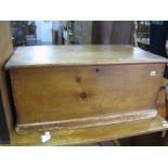 A XIX Century Pine Blanket Box, with hinged lid, carrying handles, plinth base 88cms x 40cms.