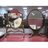 An Early XX Century Mahogany Dressing Table Mirror, oval frame on quatrefoil base; together with one