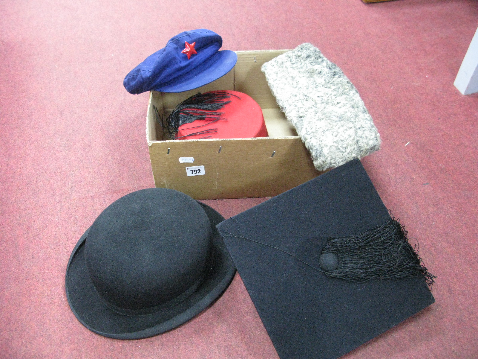 A Gents Black Bowler Hat, retailed by C. Galtry & Son, Malton, a red fez with black tassel, a