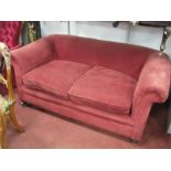 A XIX Century Two Seater Settee, on turned forefront legs.