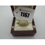 A Gent's Modern Three Row Diamond Set Ring, of uniform design channel set, stamped "750". *George (