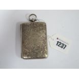 A Hallmarked Silver Case, of rectangular form allover leaf scroll engraved, initialled, the