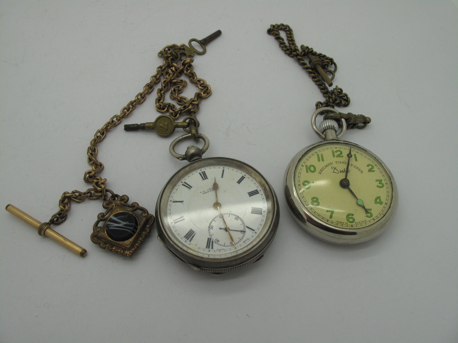 A Sliver Hallmarked Pocketwatch Stamped "925", with a yellow metal Albert chain, together with a