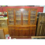 Yew Wood Breakfront Lounge Display Cabinet, with four upper glazed doors, over end drawers and