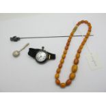 A Single Strand Graduated Amber Coloured Bead Necklace, a novelty hallmarked silver bear hatpin, a