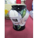 A Moorcroft Pottery Vase, painted in the trial 'White Rose' pattern, shape 146/3, impressed and