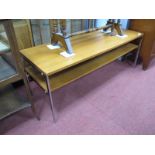 A Retro Coffee Table, with teak rectangular top and undershelf on chrome legs, 110cm wide.