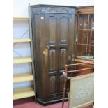 A XX Century Oak Hall Wardrobe, with linen fold panelled door, 178cm high x 80cm wide.