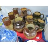 A Collection of Nine Doulton Lambeth Stoneware Jugs, each with applied decoration of hunting and