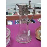 A W.M.F. Glass Claret Jug, the silver plated mounts and cover cast with stylised scrollwork, clear