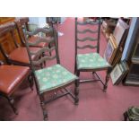 A Set of Four Oak Dining Chairs, with wavy ladder backs.