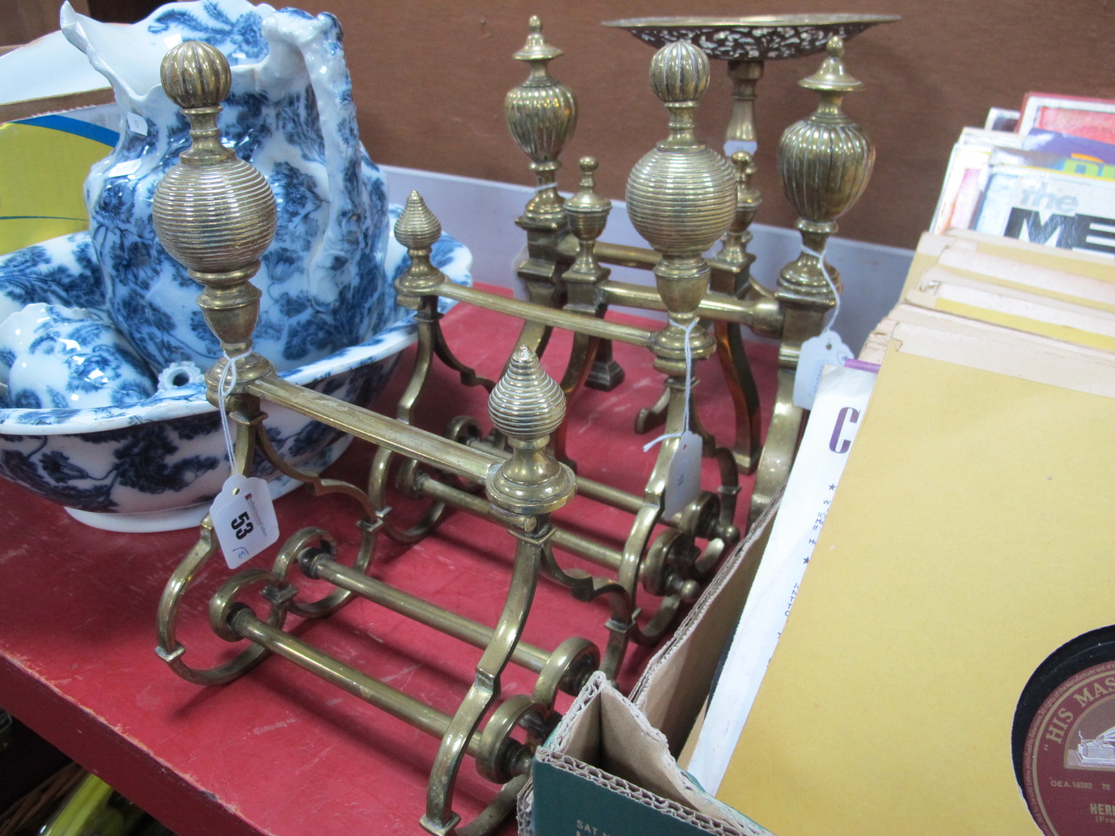 A Pair of XIX Century Brass Fire Irons, on scroll bases; together with one other pair of fire