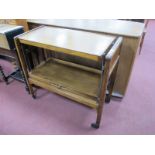 A Mid XX Century Tea Trolley, with adjustable action to twin trays.