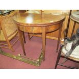 A Late XVIII Century Mahogany Demi-Lune Tea Table, with baized interior, on tapering legs and