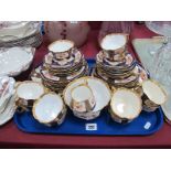 Hammersley China Tea Service, circa 1920's with floral and gilt surround panels, on blue ground,