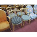 Ercol Set of Four Spindle Back Dining Chairs, bearing labels, on splayed legs, 79cm high,
