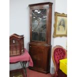 An Edwardian Inlaid Mahogany Double Corner Cupboard, the top with a glazed astragal door, three