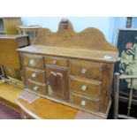 XIX Century Miniature Pine Dresser, with shaped back, central cupboard, seven drawers,having glass