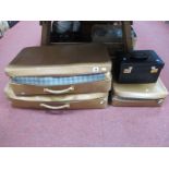 Norris England Four Tan Leather Suitcases; together with a matching vanity case and a black vanity