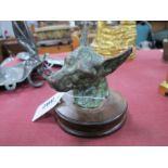 A Bronze Model of a Dog's Head, possibly a car mascot, on wooden plinth.