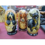 Three Russian Babushka Nesting Dolls, painted with dogs. (3)