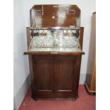 An Art Deco Oak Cocktail Cabinet, fully fitted with contemporary glasses, two decanters, cocktail