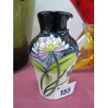 A Moorcroft Pottery Vase, painted in the 'Trefoil' design, number 23/4, impressed and painted marks,