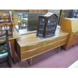 A Teak Dressing Table, with rectangular mirror, three banks, each of two drawers, having