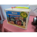 A Mamod Boxed TEI Live Steam Tractor, in good light steamed condition, complete with burner,