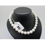 A Large Modern Single Strand Pearl Bead Necklace, the (imperfect) beads to satin finish ball