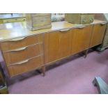 McIntosh Furniture Teak Sideboard, having curved fold-over upper handles to three left side drawers,