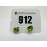 A Pair of Modern Single Stone Peridot Earstuds, oval four claw set, stamped "925".